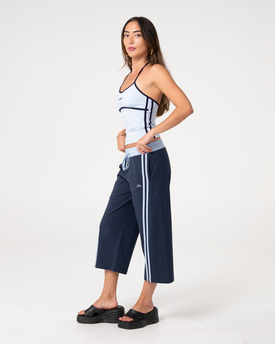 woman-wearing-maneater-fitted-halter-top-in-retro-blue-navy
