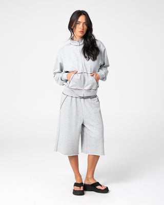 Woman wearing Servo Boxy Zip Through Fleece in Grey Marle