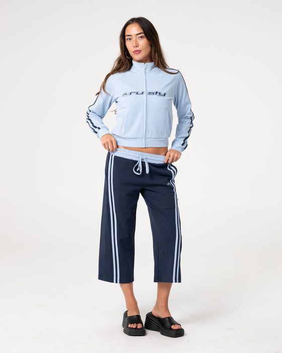 woman-wearing-maneater-fitted-zip-through-track-jacket-in-retro-blue-navy
