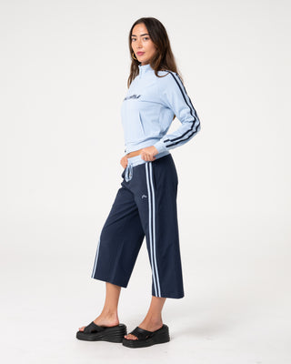 Woman wearing Maneater Fitted Zip Through Track Jacket in Retro Blue / Navy