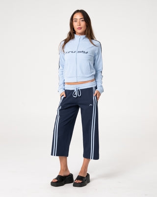 Woman wearing Maneater Fitted Zip Through Track Jacket in Retro Blue / Navy