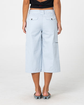 Woman wearing It Gyrl Low Rise Capri Cargo Pant in Pastel Blue