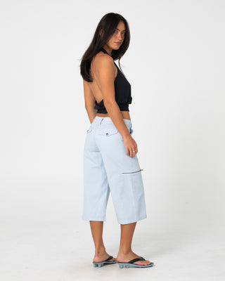 Woman wearing It Gyrl Low Rise Capri Cargo Pant in Pastel Blue
