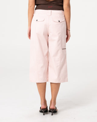 Woman wearing It Gyrl Low Rise Capri Cargo Pant in Pastel Pink