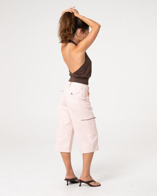 Woman wearing It Gyrl Low Rise Capri Cargo Pant in Pastel Pink