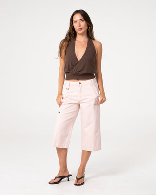 Woman wearing It Gyrl Low Rise Capri Cargo Pant in Pastel Pink
