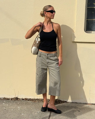 Woman wearing It Gyrl Low Rise Capri Cargo Pant in Vintage Khaki