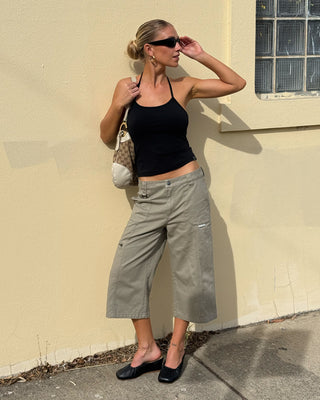 Woman wearing It Gyrl Low Rise Capri Cargo Pant in Vintage Khaki
