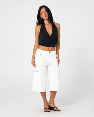 Woman wearing It Gyrl Low Rise Capri Cargo Pant in White
