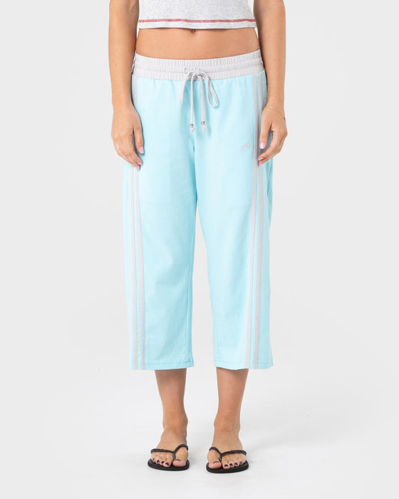 woman-wearing-maneater-low-rise-capri-track-pant-in-powder-aqua