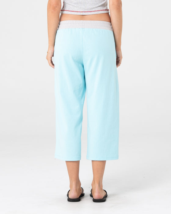 woman-wearing-maneater-low-rise-capri-track-pant-in-powder-aqua