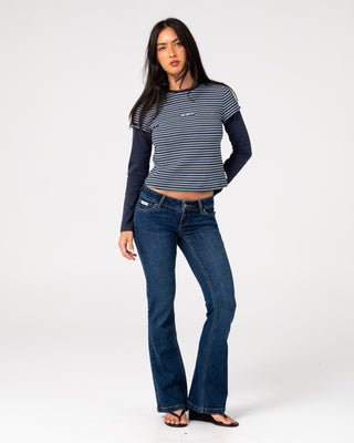 Woman wearing 18 Degrees Mock Layer Stripe Tee in Navy Blue