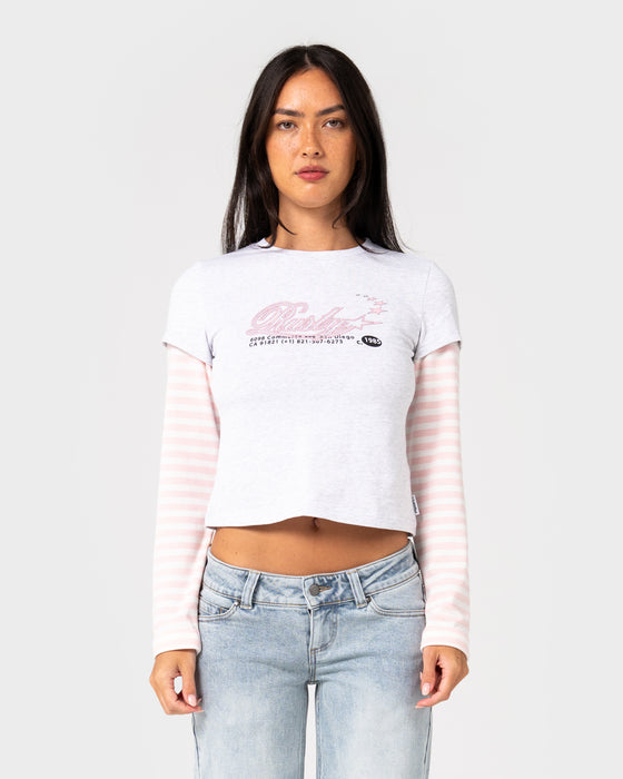 woman-wearing-star-chaser-mock-layer-tee-in-ecru-marle-pink