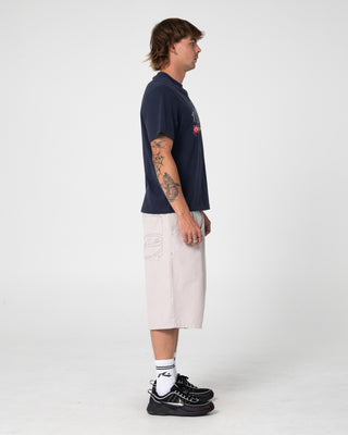 Man wearing Florilla Graphic Tee in Navy Blue