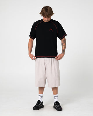 Man wearing Clarty B Raglan Tee in Black