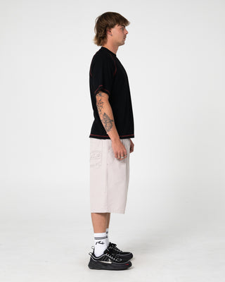 Man wearing Clarty B Raglan Tee in Black