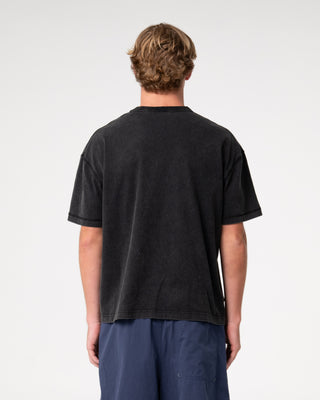 Man wearing Sosa Cropped Tee in Washed Black