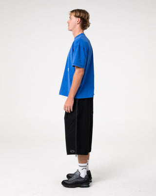 Man wearing Sosa Cropped Tee in Washed Royal Blue