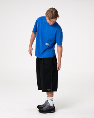 Man wearing Sosa Cropped Tee in Washed Royal Blue