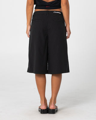 Woman wearing Big Bad Finance Mommy Low Rise Short in Black Pinstripe