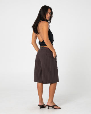 Woman wearing Big Bad Finance Mommy Low Rise Short in Java Pinstripe