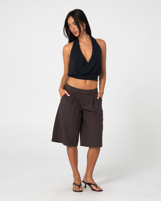 Woman wearing Big Bad Finance Mommy Low Rise Short in Java Pinstripe