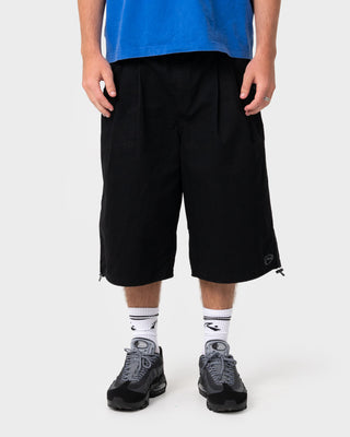Man wearing Mamba 3/4 Baggy Short in Black