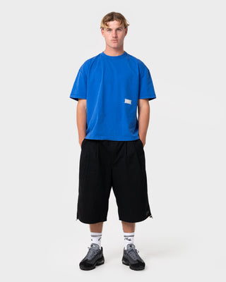 Man wearing Mamba 3/4 Baggy Short in Black