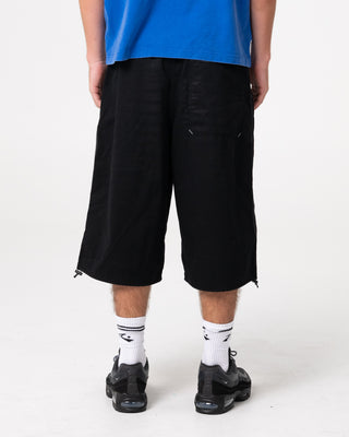 Man wearing Mamba 3/4 Baggy Short in Black