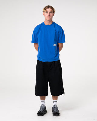 Man wearing Mamba 3/4 Baggy Short in Black