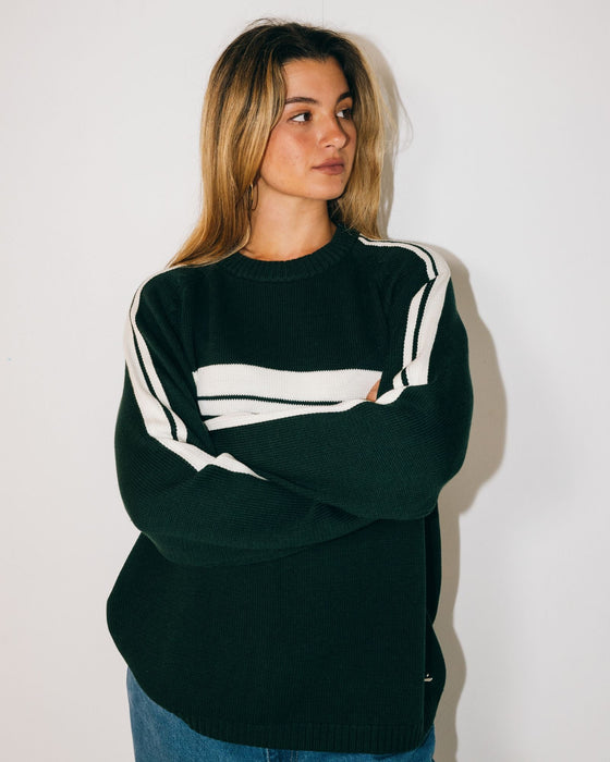 woman-wearing-white-lines-long-sleeve-crew-neck-knit-in-green-gables