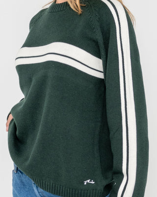 Woman wearing White Lines Long Sleeve Crew Neck Knit in Green Gables