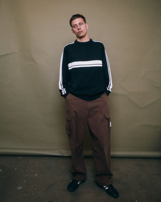 Man wearing White Lines 2.0 Knitted Crew in Black Marle