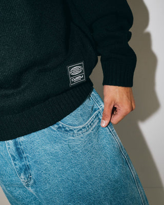 Man wearing Alpha Kappa Knitted Crew in Black