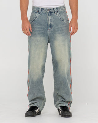 Man wearing Flip Daddy 2.0 Jean - Dirty Dawg in Dirty Dawg / Orange