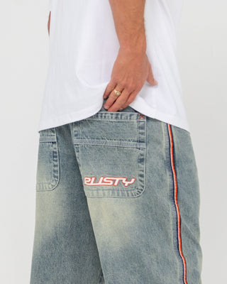 Man wearing Flip Daddy 2.0 Jean - Dirty Dawg in Dirty Dawg / Orange