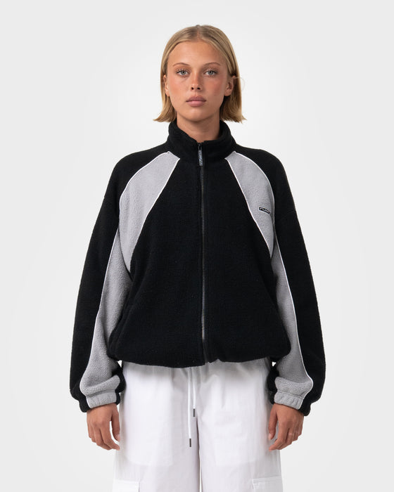 woman-wearing-two-tides-zip-through-sherpa-fleece-in-black-coming-soon
