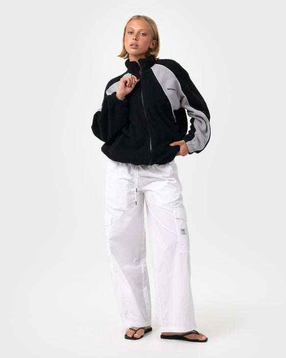 woman-wearing-two-tides-zip-through-sherpa-fleece-in-black-coming-soon