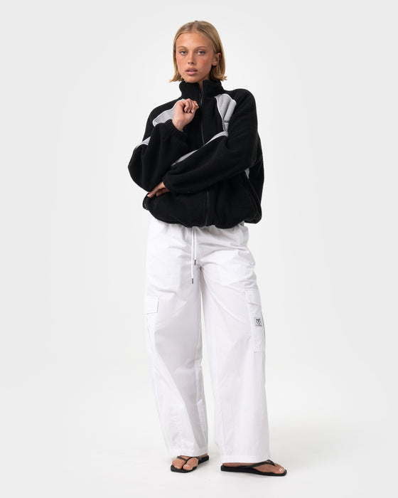 woman-wearing-two-tides-zip-through-sherpa-fleece-in-black-coming-soon