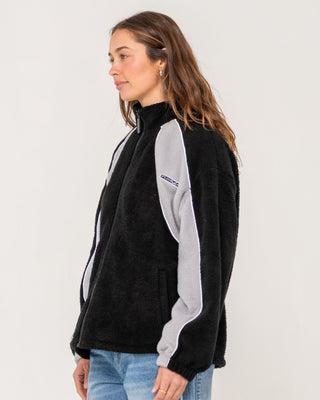Woman wearing Two Tides Zip Through Sherpa Fleece in Black