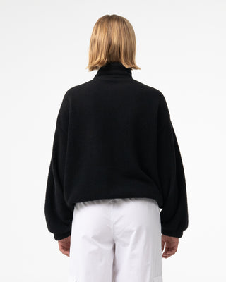Woman wearing Two Tides Zip Through Sherpa Fleece in Black - Coming Soon