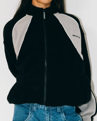 Woman wearing Two Tides Zip Through Sherpa Fleece in Black