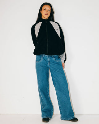 Woman wearing Two Tides Zip Through Sherpa Fleece in Black