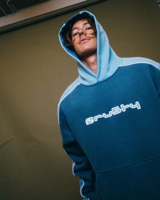 Man wearing Panela Anderson Hooded Fleece in Atlantic Blue