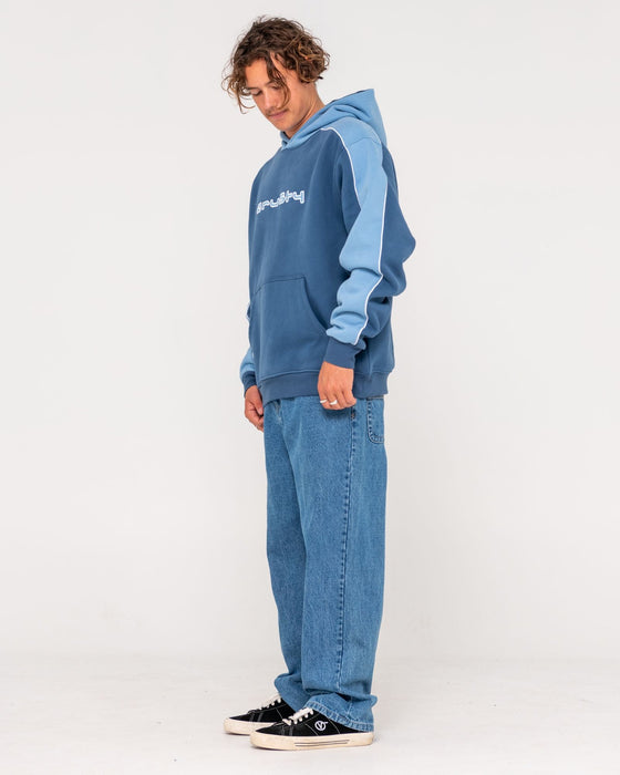 man-wearing-panela-anderson-hooded-fleece-in-atlantic-blue