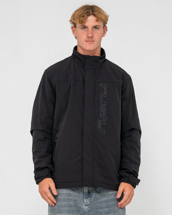 man-wearing-technic-4-way-stretch-jacket-in-black
