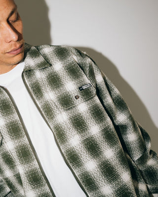 Man wearing Zeal Zip Thru Over Shirt in Army Green