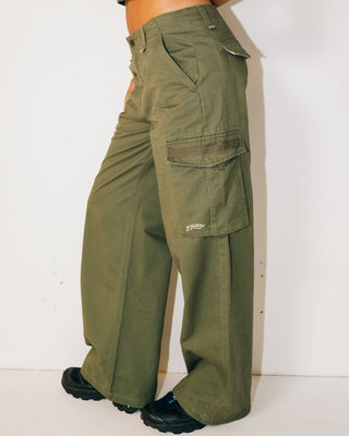 Woman wearing Tank Girl Low Rise Wide Fit Cargo Pant in Shadow Army 2