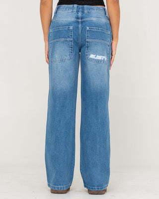 Woman wearing Flip Mommy Low Rise Wide Leg Denim Jean in Blasted Middy Blue / Blue