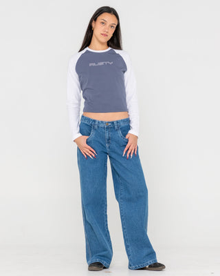 Woman wearing Flip Mommy Low Rise Tapeless Denim Jean in Authentic Blue
